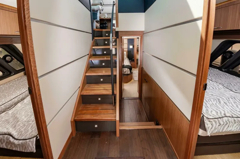Slide: The Image of Interior of 2015 Sea Ray L659 Fly yacht with wooden stairs and cozy cabins. - 43