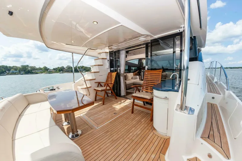 Slide: The Image of Luxurious 2015 Sea Ray L659 Fly yacht with spacious deck and elegant seating. - 7