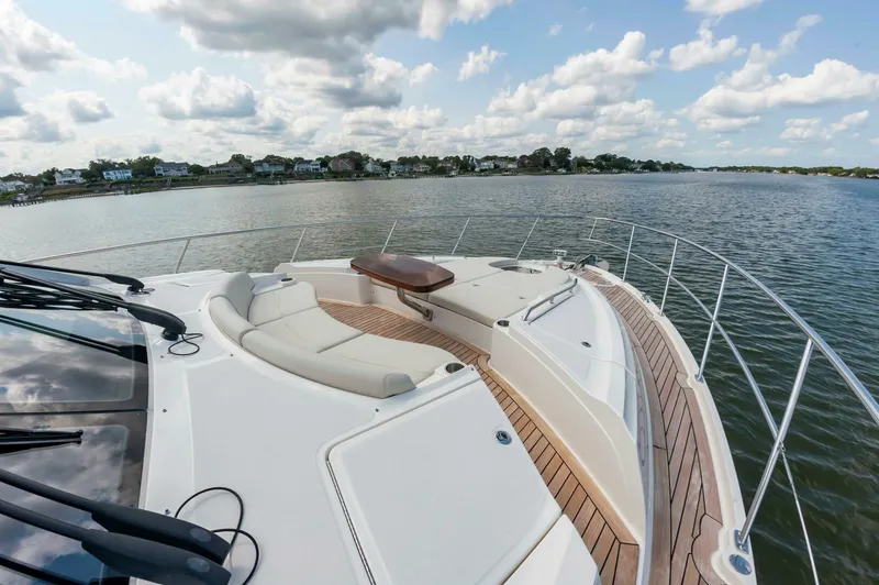 Slide: The Image of 2015 Sea Ray L659 Fly yacht with spacious deck and scenic water view. - 9