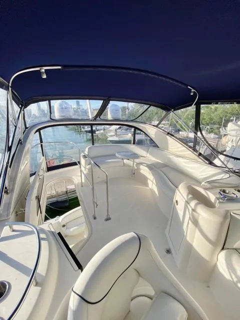 Slide: The Image of 2009 Meridian 391 Sedan yacht interior with white seating and blue canopy. - 12