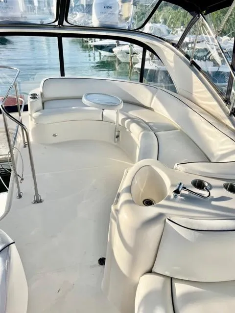 Slide: The Image of Luxurious 2009 Meridian 391 Sedan yacht interior with plush seating and panoramic windows. - 13