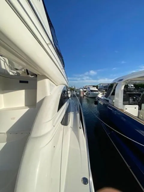 Slide: The Image of 2009 Meridian 391 Sedan yacht docked in a marina under clear blue skies. - 2