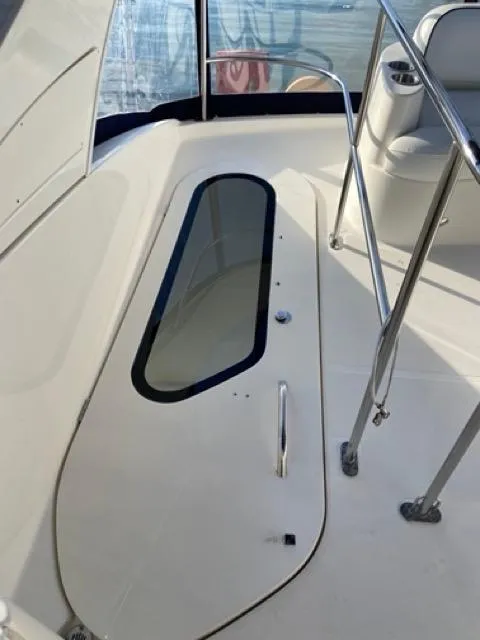 Slide: The Image of 2009 Meridian 391 Sedan yacht deck with seating and railing. - 28