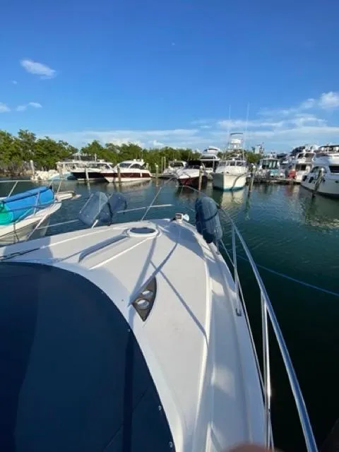 Slide: The Image of 2009 Meridian 391 Sedan yacht docked in a marina under clear blue skies. - 3