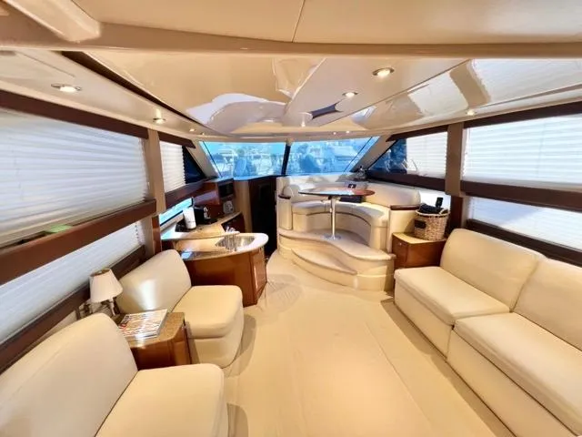 Slide: The Image of Luxurious interior of 2009 Meridian 391 Sedan yacht with elegant seating and panoramic windows. - 30