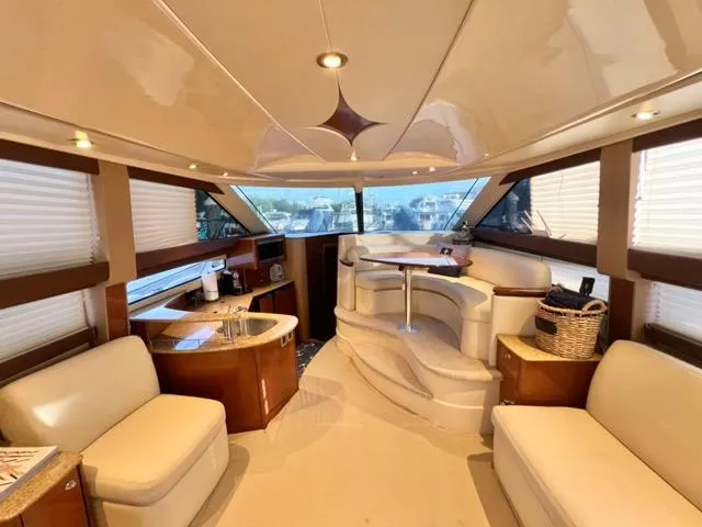 Slide: The Image of Luxurious interior of 2009 Meridian 391 Sedan yacht with elegant seating and panoramic windows. - 31