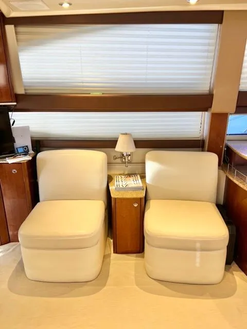 Slide: The Image of Interior of 2009 Meridian 391 Sedan with two cream chairs and a small table. - 35