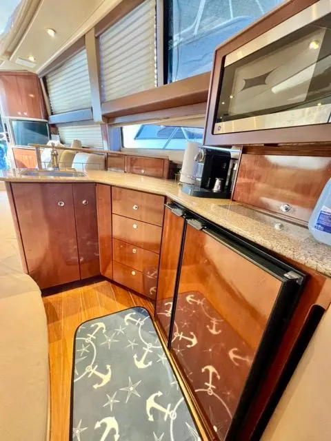 Slide: The Image of Luxurious 2009 Meridian 391 Sedan yacht interior with modern kitchen amenities. - 38