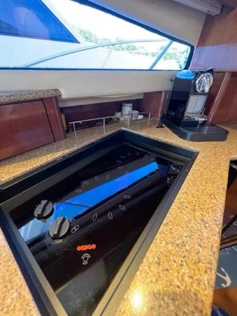Slide: The Image of 2009 Meridian 391 Sedan yacht kitchen with stovetop and coffee maker. - 39