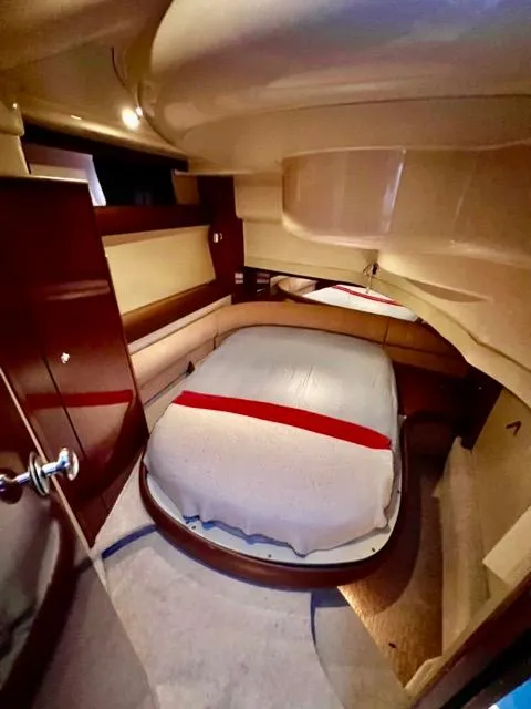 Slide: The Image of Luxurious cabin interior of 2009 Meridian 391 Sedan yacht with cozy bed. - 42