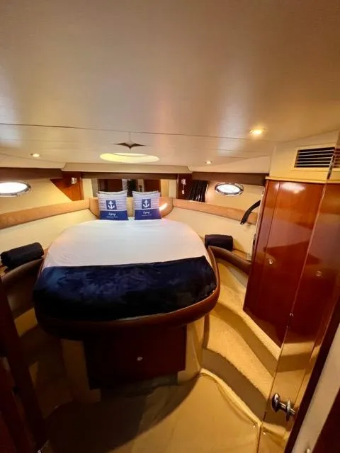 Slide: The Image of Luxurious 2009 Meridian 391 Sedan yacht bedroom interior with elegant wood finishes. - 43