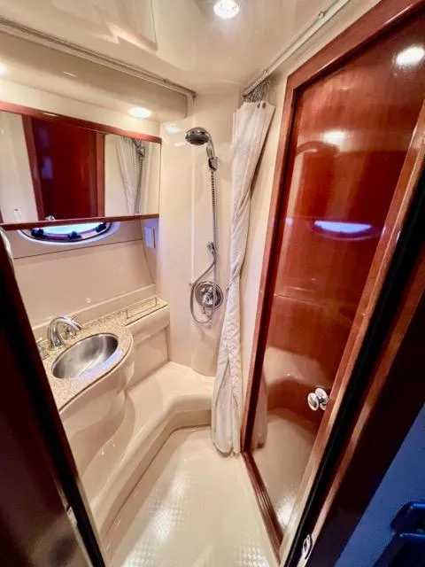 Slide: The Image of Luxurious bathroom in 2009 Meridian 391 Sedan yacht with shower and sink. - 46