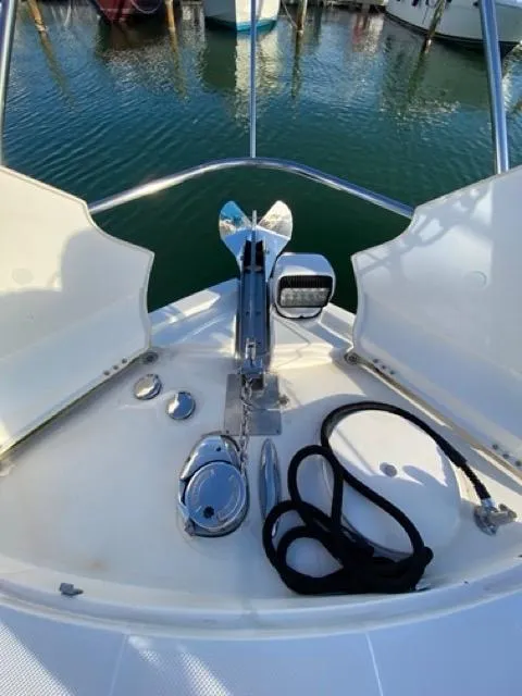 Slide: The Image of 2009 Meridian 391 Sedan yacht bow with anchor and rope, docked in marina. - 5