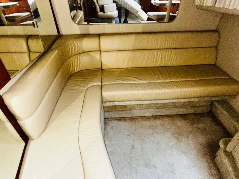Slide: The Image of Luxurious beige leather seating in 2002 Sea Ray 380 Sundancer yacht interior. - 11