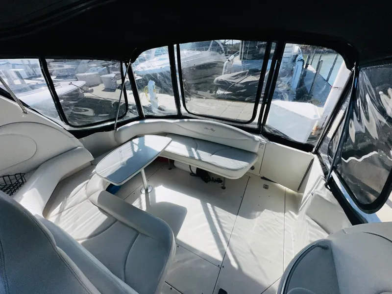 Slide: The Image of Interior of 2002 Sea Ray 380 Sundancer yacht with seating and table. - 3