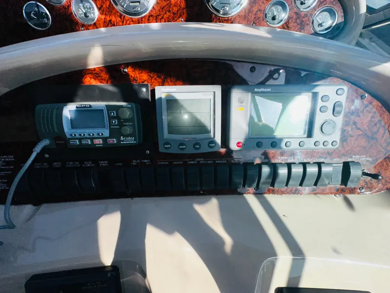 Slide: The Image of Control panel of a 2002 Sea Ray 380 Sundancer boat with navigation instruments. - 7