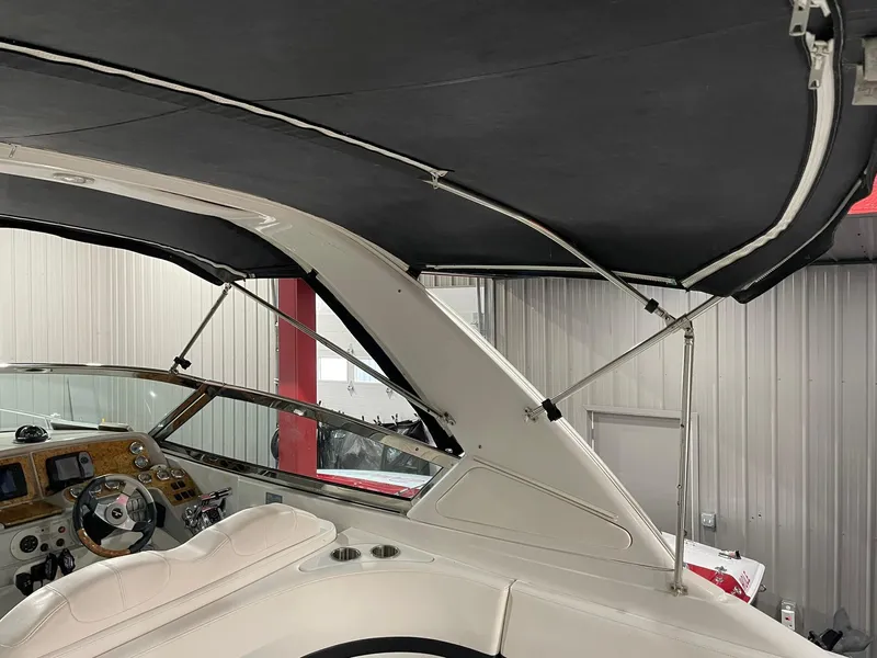 Slide: The Image of Interior view of 2006 Formula 330 Sun Sport boat with canopy and dashboard. - 12