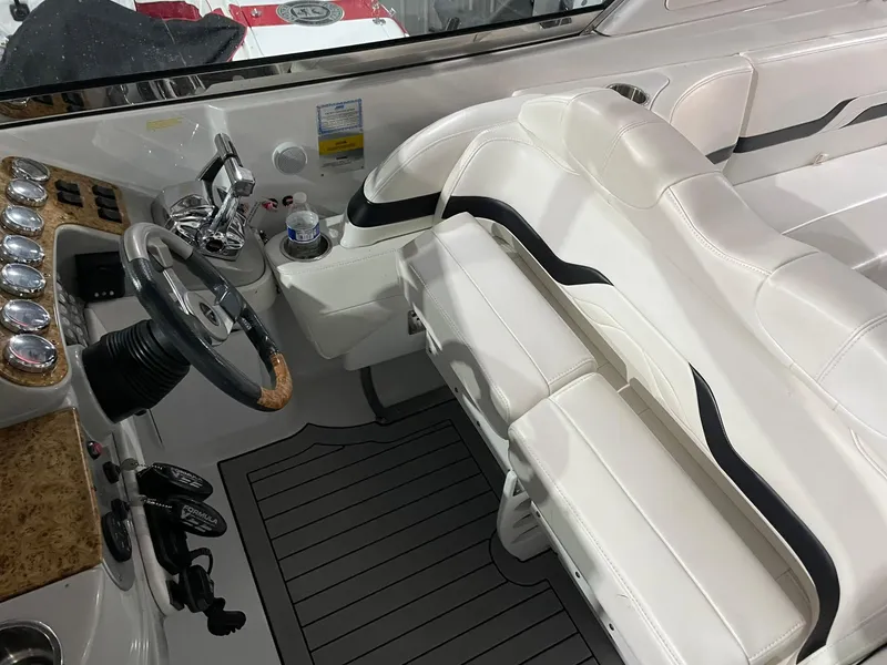 Slide: The Image of 2006 Formula 330 Sun Sport boat interior with white seating and modern dashboard. - 15