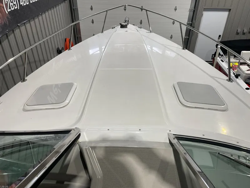 Slide: The Image of 2006 Formula 330 Sun Sport boat deck in a garage setting. - 18
