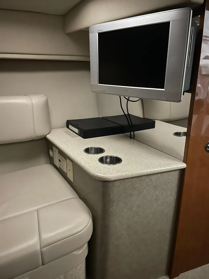 Slide: The Image of 2006 Formula 330 Sun Sport cabin interior with TV and seating area. - 25