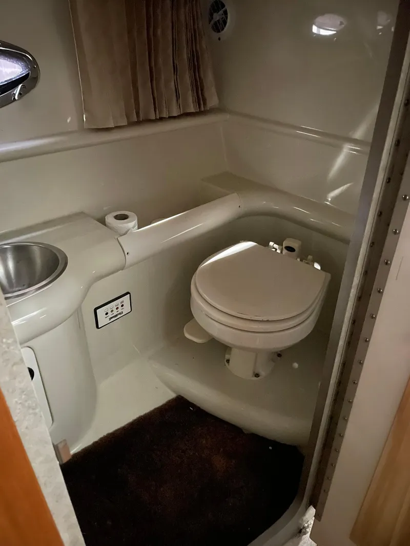 Slide: The Image of 2006 Formula 330 Sun Sport boat bathroom with toilet and sink. - 27