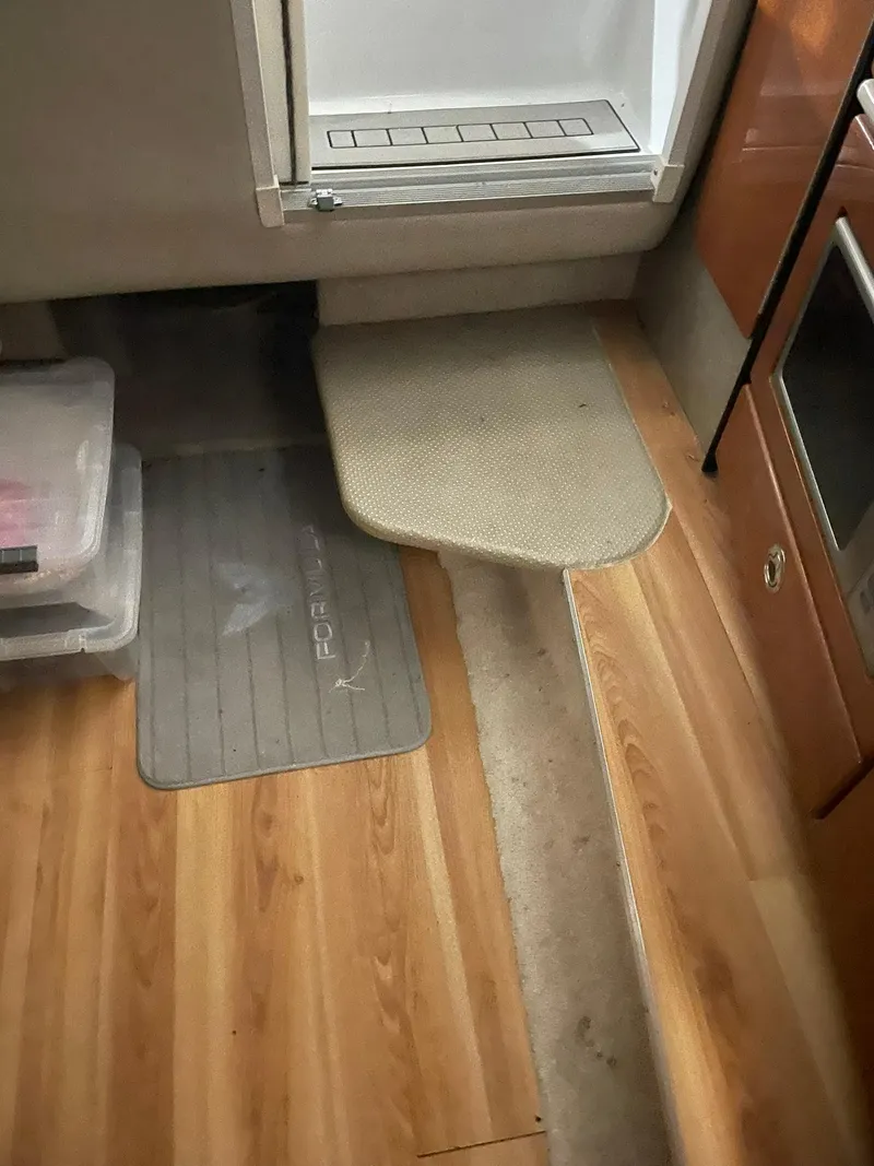 Slide: The Image of Interior of 2006 Formula 330 Sun Sport with wood flooring and storage. - 28