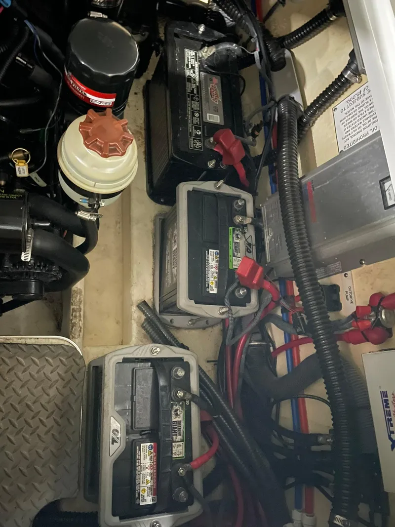 Slide: The Image of 2006 Formula 330 Sun Sport engine compartment with batteries and wiring. - 35