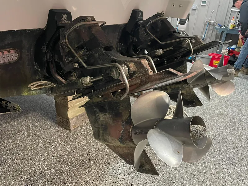 Slide: The Image of 2006 Formula 330 Sun Sport boat propellers in a garage setting. - 36