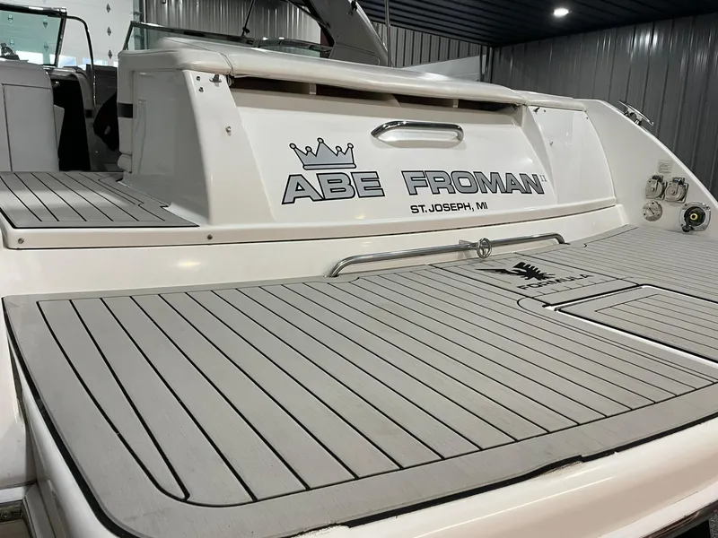 Slide: The Image of 2006 Formula 330 Sun Sport boat with "Abe Froman" name, docked indoors. - 7