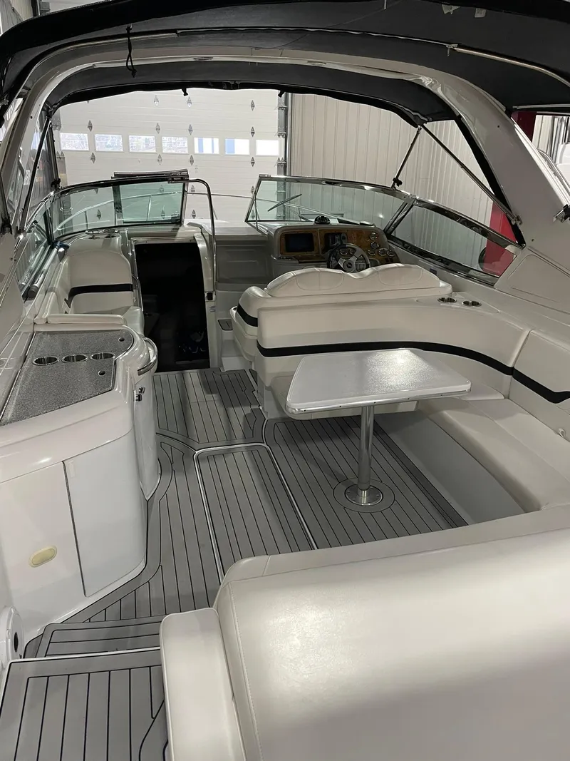 Slide: The Image of 2006 Formula 330 Sun Sport boat interior with seating and helm. - 8