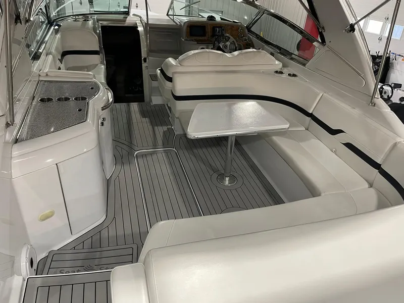 Slide: The Image of 2006 Formula 330 Sun Sport boat interior with seating and table. - 9