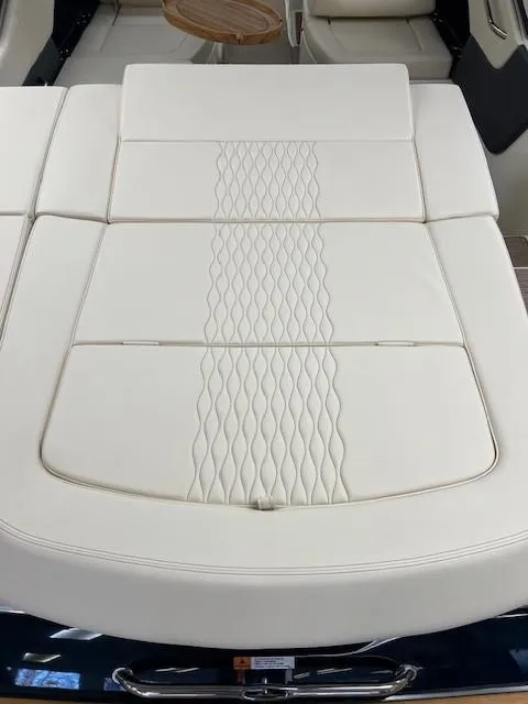 Slide: The Image of 2025 Chris-Craft Sportster 25 boat with elegant white leather seating. - 11