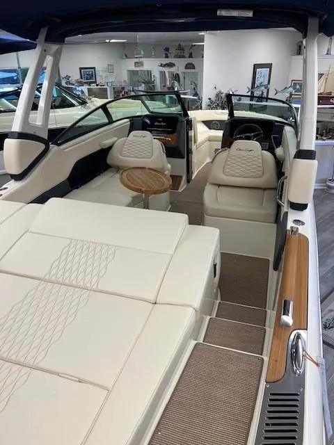 Slide: The Image of 2025 Chris-Craft Sportster 25 boat interior with luxurious seating and modern design. - 12