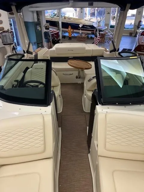Slide: The Image of 2025 Chris-Craft Sportster 25 boat interior with luxurious seating and modern design. - 16