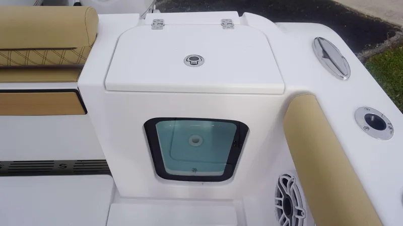 Slide: The Image of 2025 Sportsman 282 Open boat interior with storage compartment and cushioned seating. - 16