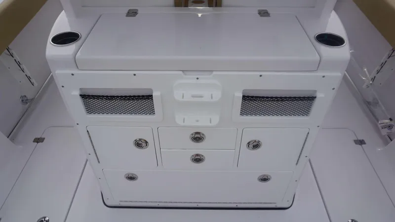Slide: The Image of 2025 Sportsman 282 Open boat storage compartment with drawers and cup holders. - 17