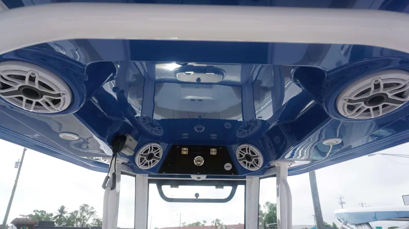 Slide: The Image of 2025 Sportsman 282 Open boat interior with blue ceiling and integrated speakers. - 26