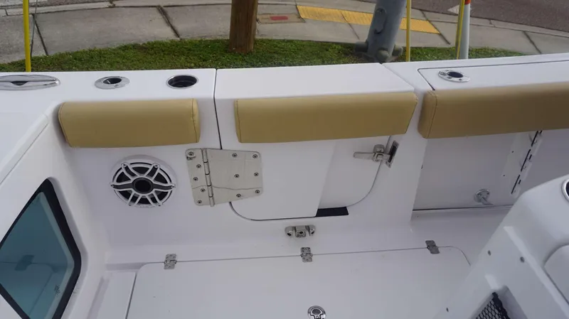 Slide: The Image of 2025 Sportsman 282 Open boat interior with cushioned seating and speaker system. - 28