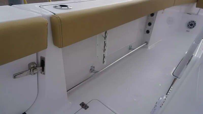 Slide: The Image of 2025 Sportsman 282 Open boat interior with tan seating and stainless steel fixtures. - 30