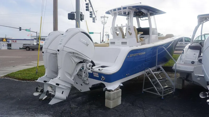 Slide: The Image of 2025 Sportsman 282 Open boat with dual outboard engines on display. - 7