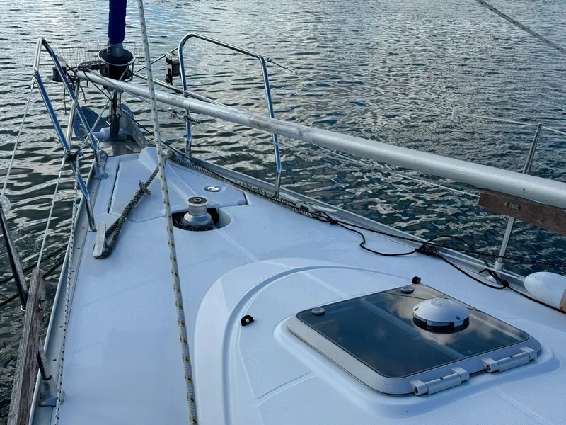 Slide: The Image of Deck view of 2001 Jeanneau Sun Odyssey 40 sailboat on calm water. - 11