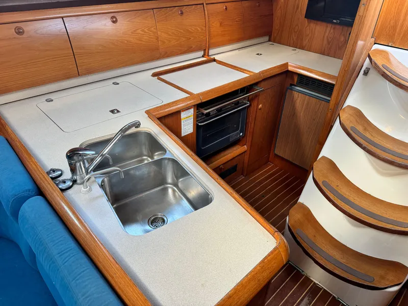 Slide: The Image of Interior of 2001 Jeanneau Sun Odyssey 40 yacht kitchen with sink and oven. - 21