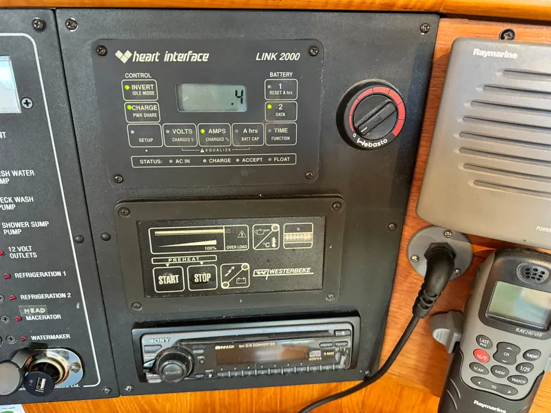 Slide: The Image of Control panel of a 2001 Jeanneau Sun Odyssey 40 sailboat with navigation and communication equipment. - 23