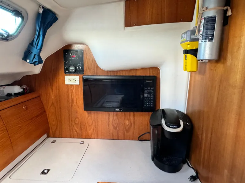 Slide: The Image of Interior of 2001 Jeanneau Sun Odyssey 40 with microwave and coffee maker. - 24