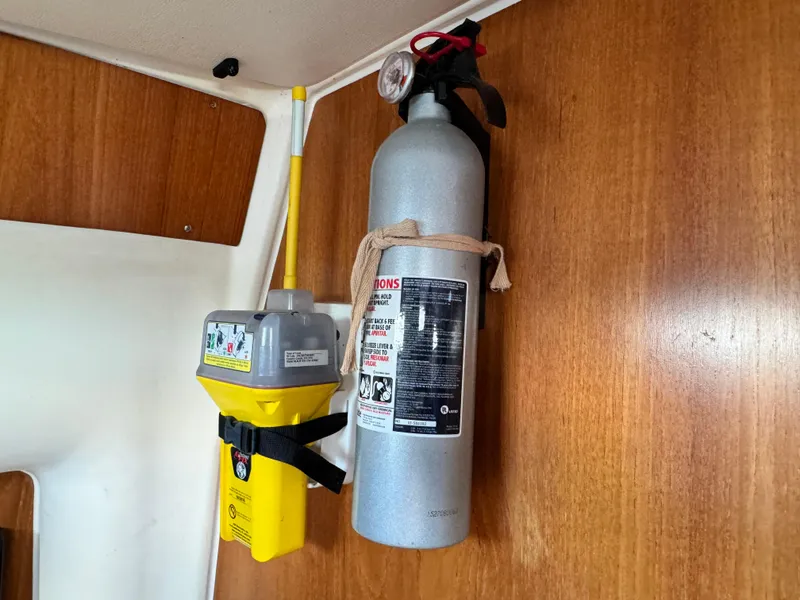 Slide: The Image of Fire extinguisher and emergency beacon on 2001 Jeanneau Sun Odyssey 40 yacht interior. - 25