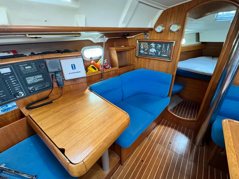 Slide: The Image of Interior of 2001 Jeanneau Sun Odyssey 40 sailboat with blue seating and wooden finishes. - 31