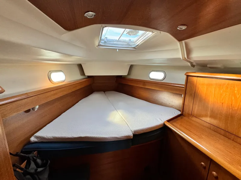 Slide: The Image of Cozy cabin interior of 2001 Jeanneau Sun Odyssey 40 sailboat with wooden finish. - 38