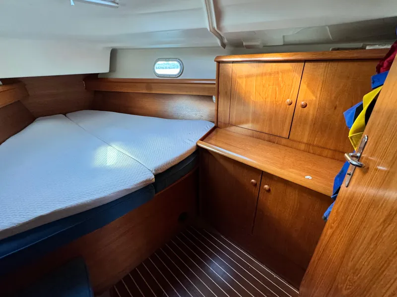 Slide: The Image of Cozy cabin interior of 2001 Jeanneau Sun Odyssey 40 sailboat with wooden furnishings. - 39