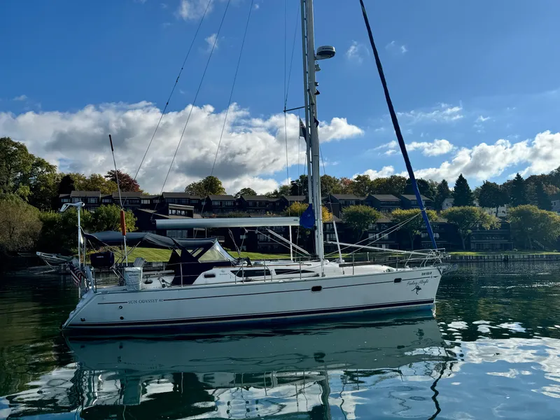 Slide: The Image of 2001 Jeanneau Sun Odyssey 40 sailboat on calm water under blue sky. - 4