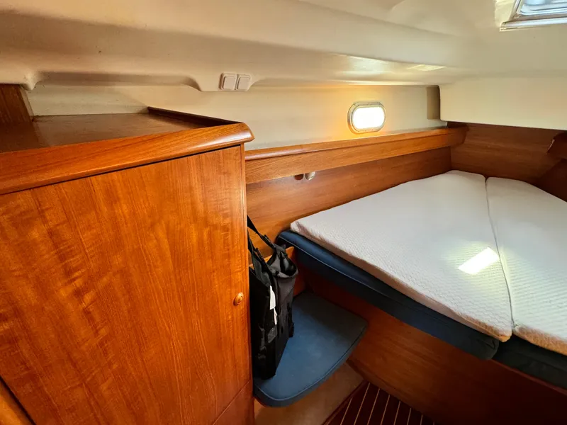 Slide: The Image of Cozy cabin interior of 2001 Jeanneau Sun Odyssey 40 sailboat with wooden furnishings. - 40